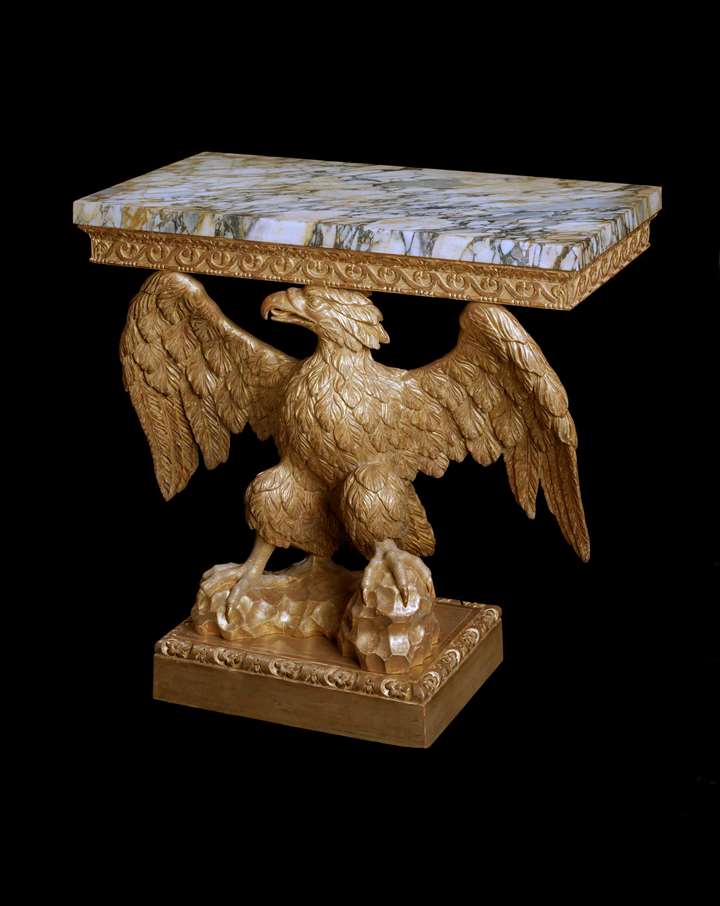 A GEORGE II GILTWOOD EAGLE CONSOLE TABLE